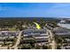 Aerial view showcasing building's proximity to local amenities and lush surroundings at 131 Bluff View Dr # 208, Belleair Bluffs, FL 33770