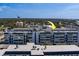 Aerial view of the building with rooftops and sky in the background at 131 Bluff View Dr # 208, Belleair Bluffs, FL 33770