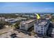 Wide aerial shot of the building and nearby waterway at 131 Bluff View Dr # 208, Belleair Bluffs, FL 33770