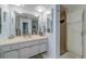 Bright bathroom featuring a shower and a spacious white vanity at 131 Bluff View Dr # 208, Belleair Bluffs, FL 33770