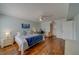 Bright bedroom with hardwood floors, a ceiling fan, and plenty of natural light at 131 Bluff View Dr # 208, Belleair Bluffs, FL 33770