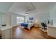 Comfortable bedroom featuring a ceiling fan and an adjacent office space at 131 Bluff View Dr # 208, Belleair Bluffs, FL 33770