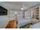 Comfortable bedroom with built-in storage and adjacent bathroom access at 131 Bluff View Dr # 208, Belleair Bluffs, FL 33770
