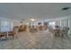 Spacious common area featuring tile flooring, comfortable seating arrangements and bright natural light at 131 Bluff View Dr # 208, Belleair Bluffs, FL 33770