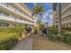 Well-maintained courtyard with lush greenery, grills, and seating, creating a welcoming outdoor space for residents at 131 Bluff View Dr # 208, Belleair Bluffs, FL 33770