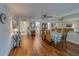 Dining room with hardwood floors and view to kitchen and entryway at 131 Bluff View Dr # 208, Belleair Bluffs, FL 33770