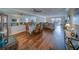 Spacious dining room with hardwood floors, ceiling fan and lots of light at 131 Bluff View Dr # 208, Belleair Bluffs, FL 33770