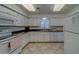 Functional white kitchen with essential appliances and ample cabinet space for easy meal preparation at 131 Bluff View Dr # 208, Belleair Bluffs, FL 33770