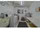 Functional laundry room with modern appliances, ample counter space, and storage options for efficient laundry management at 131 Bluff View Dr # 208, Belleair Bluffs, FL 33770