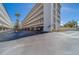 Condo building featuring covered parking and well-maintained grounds, ideal for secure parking at 131 Bluff View Dr # 208, Belleair Bluffs, FL 33770