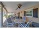 Comfortable covered patio with multiple tables and seating, perfect for enjoying the outdoors and community views at 131 Bluff View Dr # 208, Belleair Bluffs, FL 33770