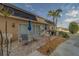 Outdoor patio with dining set, grill, and lovely landscaping at 131 Bluff View Dr # 208, Belleair Bluffs, FL 33770