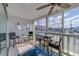 Sunroom features a cozy seating area, ample natural light, and panoramic views of the surrounding area, perfect for relaxation at 131 Bluff View Dr # 208, Belleair Bluffs, FL 33770