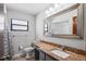 Bathroom featuring vanity with granite countertop and a window at 13112 Groveland St, Spring Hill, FL 34609