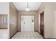 Bright foyer with white tile floors and a front door with sidelights at 13112 Groveland St, Spring Hill, FL 34609