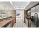 Modern kitchen featuring stainless steel appliances, granite counters, and tile flooring at 13112 Groveland St, Spring Hill, FL 34609