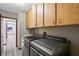 Clean laundry room featuring tile floors and modern washer and dryer at 13112 Groveland St, Spring Hill, FL 34609