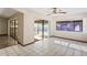 Living room featuring sliding glass doors leading to a screened pool area at 13112 Groveland St, Spring Hill, FL 34609