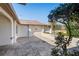 View of the side patio with brick pavers at 13112 Groveland St, Spring Hill, FL 34609