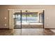 View of the patio and pool through glass sliding doors at 13112 Groveland St, Spring Hill, FL 34609