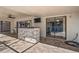 This open patio features a stone bar, recessed lighting, and convenient access to the pool at 13112 Groveland St, Spring Hill, FL 34609