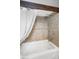 Elegant bathroom with a soaking tub, tiled walls, and a rain shower head at 1350 Maple Sw St, Largo, FL 33770