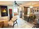 Charming dining room with wooden table, green chairs, stylish light fixture, and sliding barn door at 1350 Maple Sw St, Largo, FL 33770