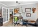 Bright office space with wood desk, gallery wall and French doors at 1350 Maple Sw St, Largo, FL 33770