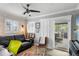The living room boasts natural light, shiplap accent wall, and access to the outdoor patio at 1350 Maple Sw St, Largo, FL 33770