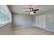 Bright bedroom with ceiling fan, window, and closet at 18236 Ackerman Ave, Port Charlotte, FL 33948