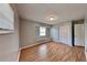 This bedroom features laminate wood floors, closet and a window seat area at 18236 Ackerman Ave, Port Charlotte, FL 33948