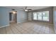 Bright living room featuring neutral paint, tile flooring, and ample natural light at 18236 Ackerman Ave, Port Charlotte, FL 33948