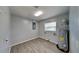 Utility room with laminate flooring, window for natural light, and water heater at 18236 Ackerman Ave, Port Charlotte, FL 33948