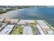 Aerial photo shows waterfront access, surrounding green spaces, and serene community setting at 19029 Us Highway 19 N # 30H, Clearwater, FL 33764