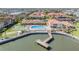Aerial view of a community including pool, pier, and green space at 19029 Us Highway 19 N # 30H, Clearwater, FL 33764