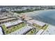 Aerial view of townhome community showcasing the buildings and waterfront at 19029 Us Highway 19 N # 30H, Clearwater, FL 33764