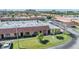 Aerial view of condo showing a well-maintained lawn and close proximity to carports at 19029 Us Highway 19 N # 30H, Clearwater, FL 33764