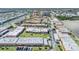 Aerial view showcases well-maintained complexes, lush landscaping, and waterfront access in a desirable community at 19029 Us Highway 19 N # 30H, Clearwater, FL 33764