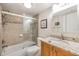 Well-lit bathroom with granite countertops, tiled shower, and modern fixtures at 19029 Us Highway 19 N # 30H, Clearwater, FL 33764