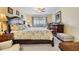 Bright bedroom featuring a large bed, soft carpet, and neutral paint at 19029 Us Highway 19 N # 30H, Clearwater, FL 33764