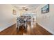 Charming dining room area with hardwood flooring, modern furniture, and easy access to kitchen and living spaces at 19029 Us Highway 19 N # 30H, Clearwater, FL 33764