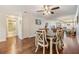 Open dining area featuring a modern light fixture and hardwood floors at 19029 Us Highway 19 N # 30H, Clearwater, FL 33764