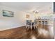 Cozy dining room area with hardwood flooring, modern furniture, and easy access to the kitchen and living spaces at 19029 Us Highway 19 N # 30H, Clearwater, FL 33764