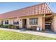 Charming single-story villa with well-maintained lawn, carport, and an American flag waving at 19029 Us Highway 19 N # 30H, Clearwater, FL 33764