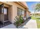 Inviting front entrance with a glass storm door and lovely landscaping with a stone border at 19029 Us Highway 19 N # 30H, Clearwater, FL 33764