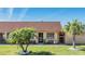Delightful villa boasting a terra-cotta-colored roof, well-kept lawn and tropical palm trees at 19029 Us Highway 19 N # 30H, Clearwater, FL 33764