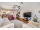 Spacious living room with hardwood floors and a ceiling fan at 19029 Us Highway 19 N # 30H, Clearwater, FL 33764