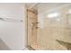 Tiled shower stall with built-in corner shelves, glass enclosure and showerhead with adjustable height at 19029 Us Highway 19 N # 30H, Clearwater, FL 33764