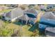 Overhead view of a home with a well-manicured backyard and outdoor seating at 20326 Merry Oak Ave, Tampa, FL 33647