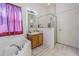 Bright bathroom featuring a tub-shower combo, tile flooring, and a single sink vanity at 20326 Merry Oak Ave, Tampa, FL 33647